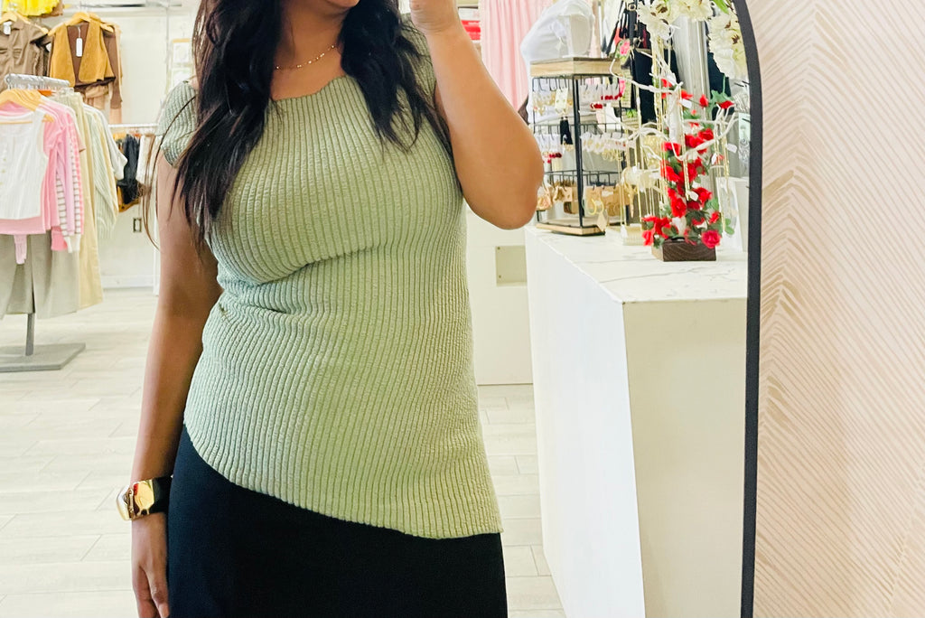 Sleeveless asymmetric hem knit top